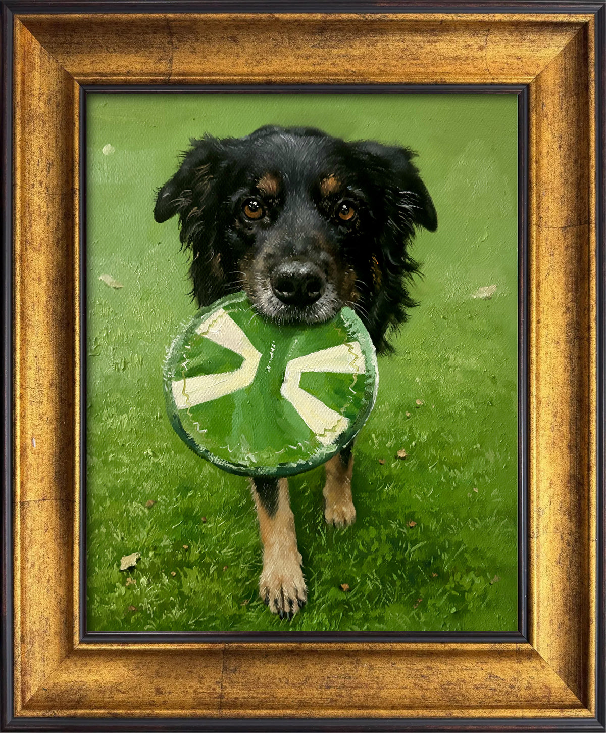 Custom hand-painted realistic dog oil portrait from a photo, featuring a black and tan dog holding its favorite green toy outdoors on the grass.